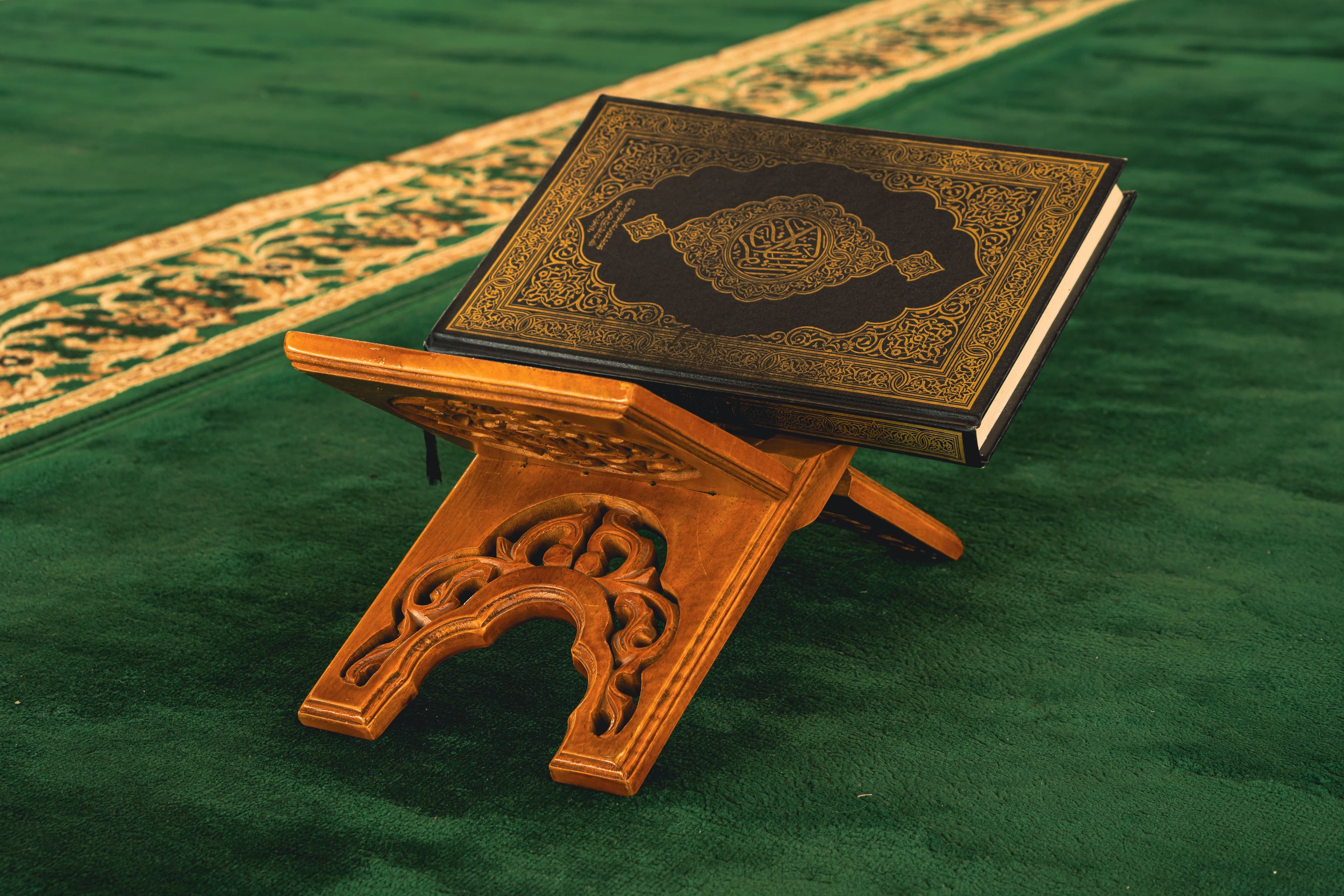 Holy Quran on a traditional wooden rehal stand